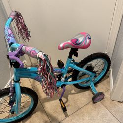 Dynacraft Twilight Twist 16" Bike with training wheels. Gently used condition. Turquoise and purple.  $40