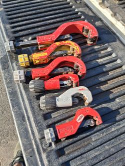 Reed tubing cutters