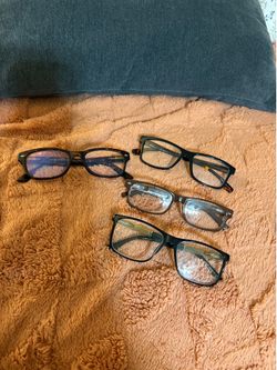 Four pairs of reading glasses