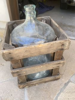Antique bottle in wood frame