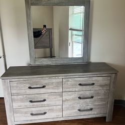Queen size bedframe with headboard, dresser, and mirror
