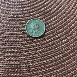 Sacagawea Gold Dollar  And Date 2010.   It’s a Little  Dirty  And Haves Stars And A 5