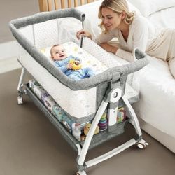 NEW Baby Bassinet Bedside Sleeper with Mesh and Storage Basket and Wheels New, Open Box