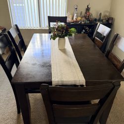 Dining room with 6 leather chairs, the table extends to a larger size.