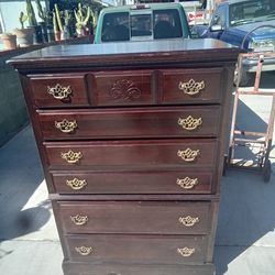 Has 6 Drawers all work slight  damageon top