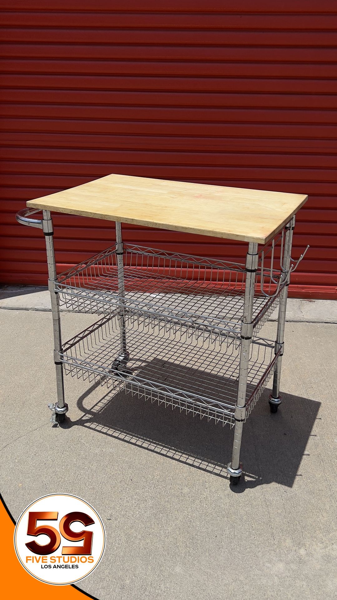 StyleWell Gatefield Chrome Rolling Kitchen Cart with Butcher Block Top and Tiered Storage Shelves.