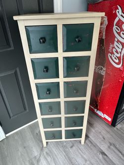 Tall cabinet with drawers.