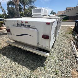 Trail Manor pop-up travel trailer.