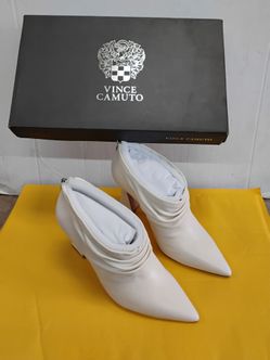 Vince Camuto Ameliava booties in creamy white baby sheep leather featuring a sleek ankle-high silhouette with a slim heel 8M