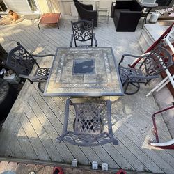 Stone table w/ fire + 4 chairs