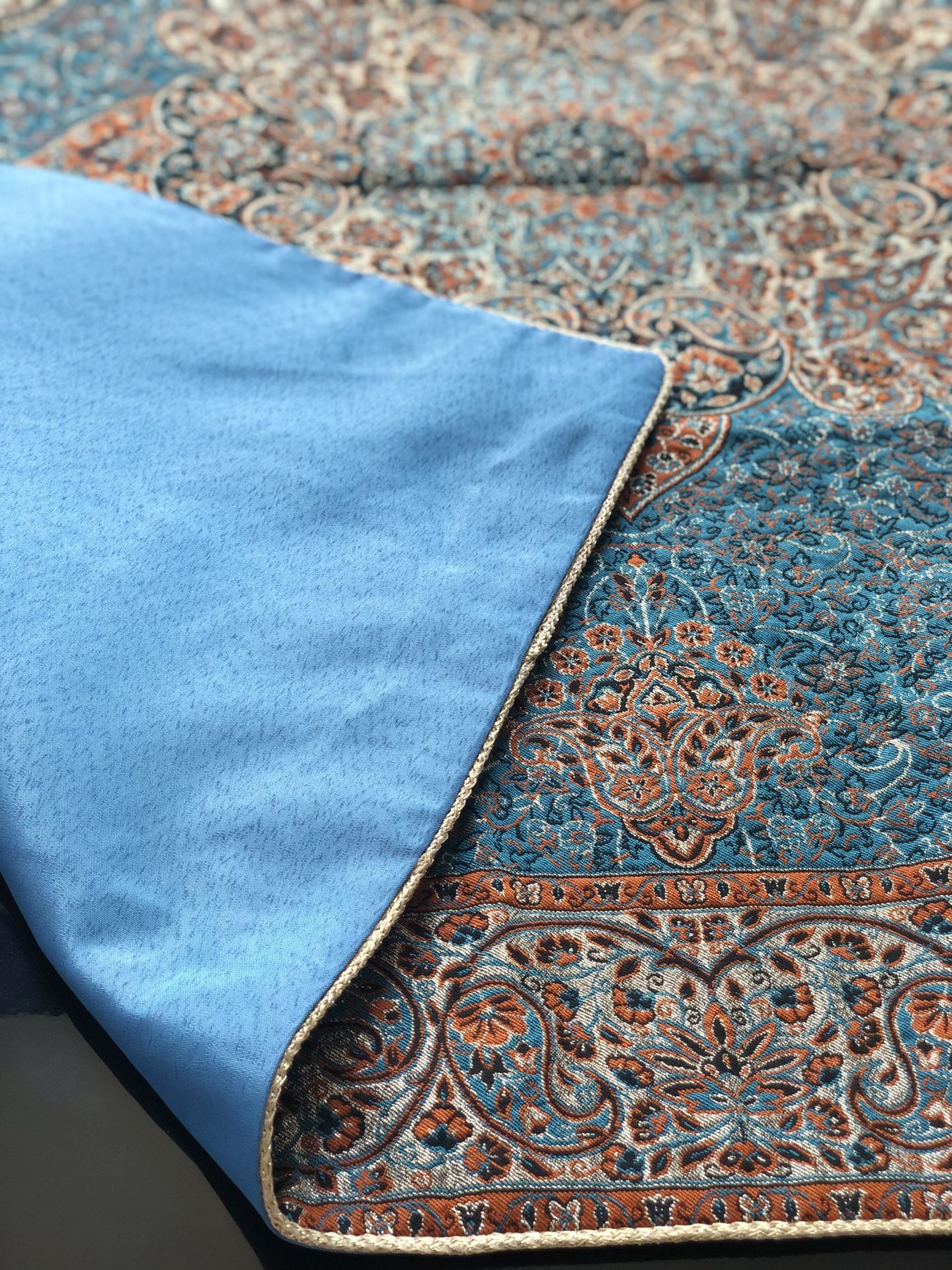 Elegant blue and gold table cover with many details