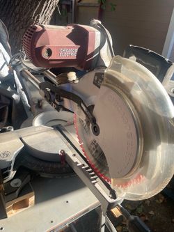 12-inch Dual-Bevel Sliding Compound Miter Saw Chicago Electric mounted on a wheeled, collapsible stand.