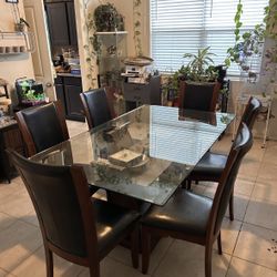 Beautiful solid table Set with glass top "FIRM ON PRICE" Chairs Included 