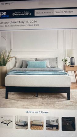 king sized mattress and black platform bedframe