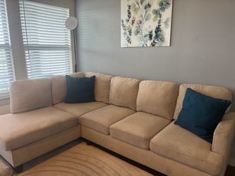 Tan couch with pillows