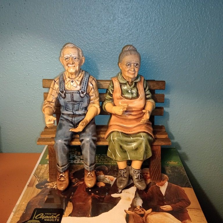 1990 Hershey Collectable. Old Man & Woman Sitting On Bench.