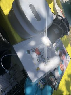 A Baby Sterilizer Machine With Baby Picture Album