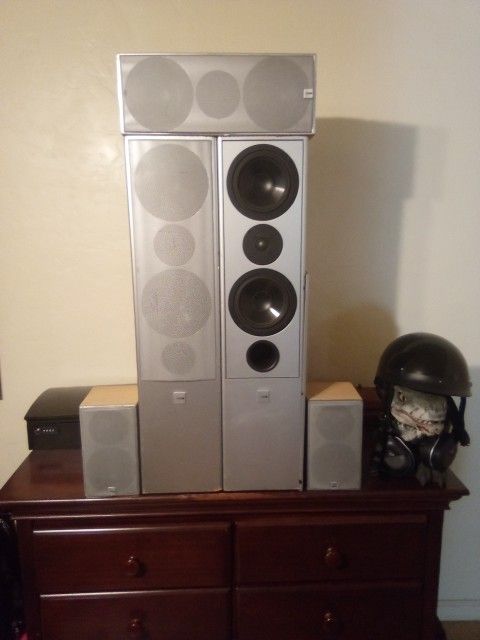 CANTON TOWERS WITH REAR AND CENTER CHANNEL SPEAKERS.