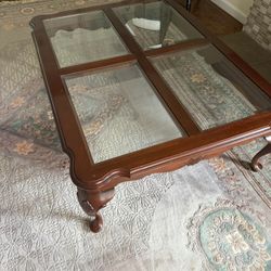 Brand name Ethan Allen Coffee Table with glass surface panels on fine wood.   Ethan Allen coffee table with glass sectional surface and beautiful wood
