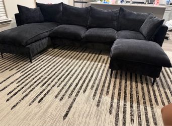 Black couch and Rug