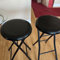 2 black bar stools