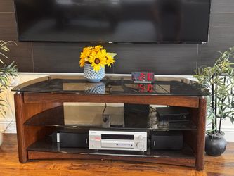 Walen Wooden TV stand with glass top and shelves.
