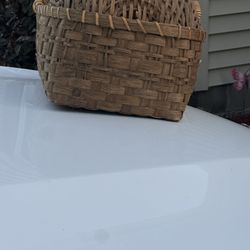 Old antique brown wicker cradle in perfect shape