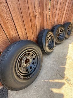 Four trailer Rims and Tires 205 x75 x14