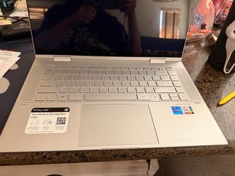 HP ENVY x360 15.6" with an Intel i7 11th Gen processor, 16GB RAM, and a 512GB SSD