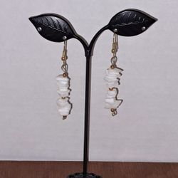 Cute dangling white pierced earrings. New