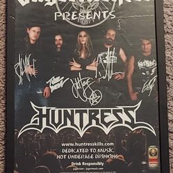 Framed autographed concert poster of Huntress 
