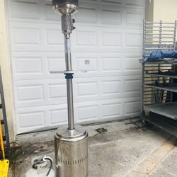 Two months old outdoor stainless steel heater. Comes with refillable tank and attachments