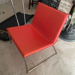 CB2 Tangerine Orange Vegan Leather Lounge Chair with Chrome Base