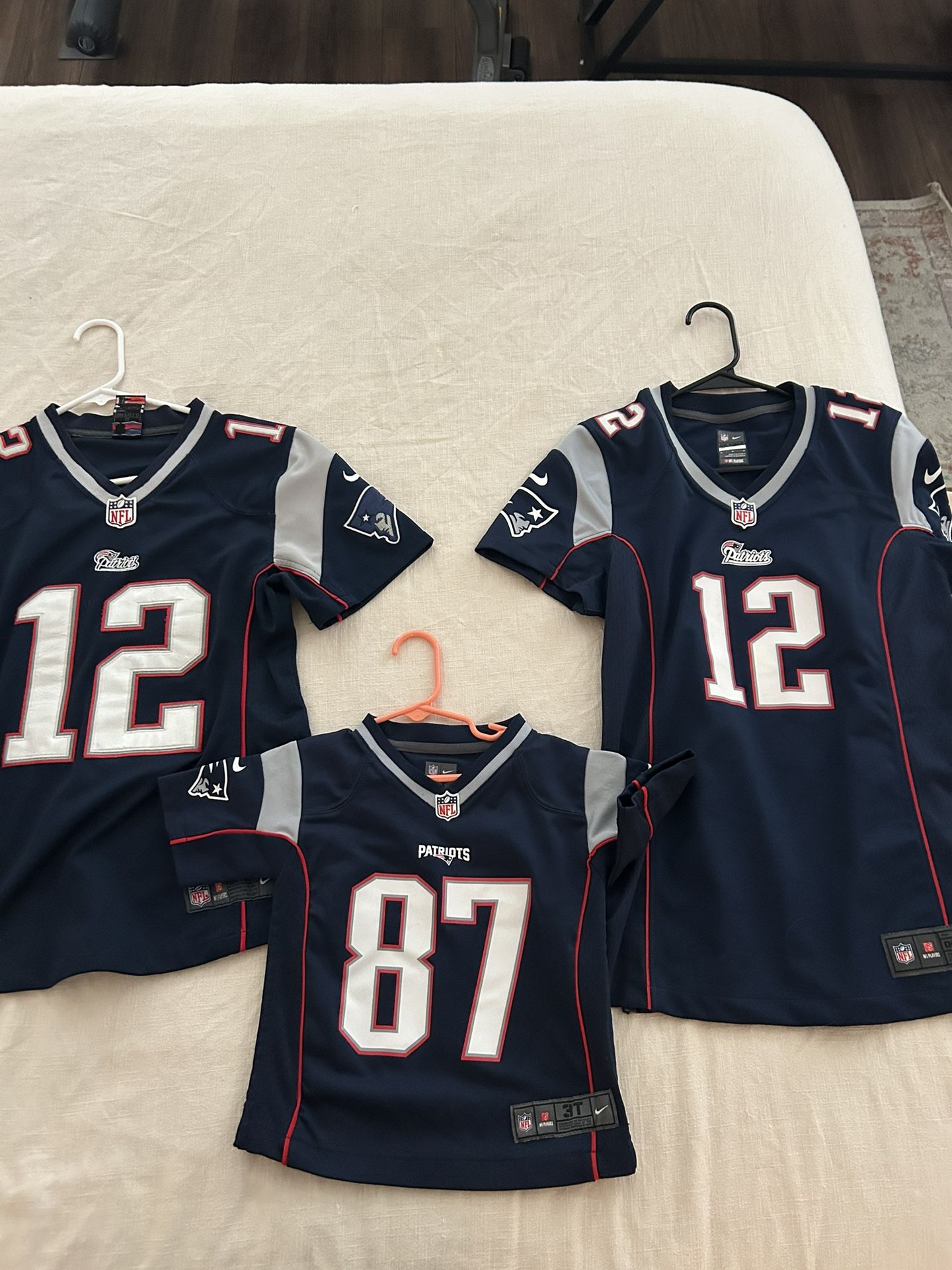 Patriots Jerseys. Two Women’s And One Child