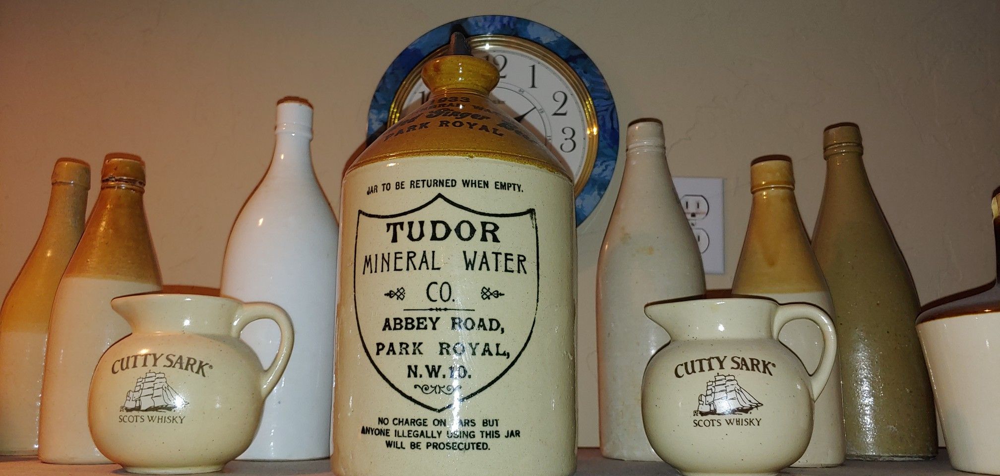 Antique jugs mugs and bottles