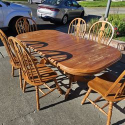 Large table six chairs two leaves and they stored under the table.They dropped down