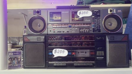 Two dual-cassette recorders and a Sharp radio.