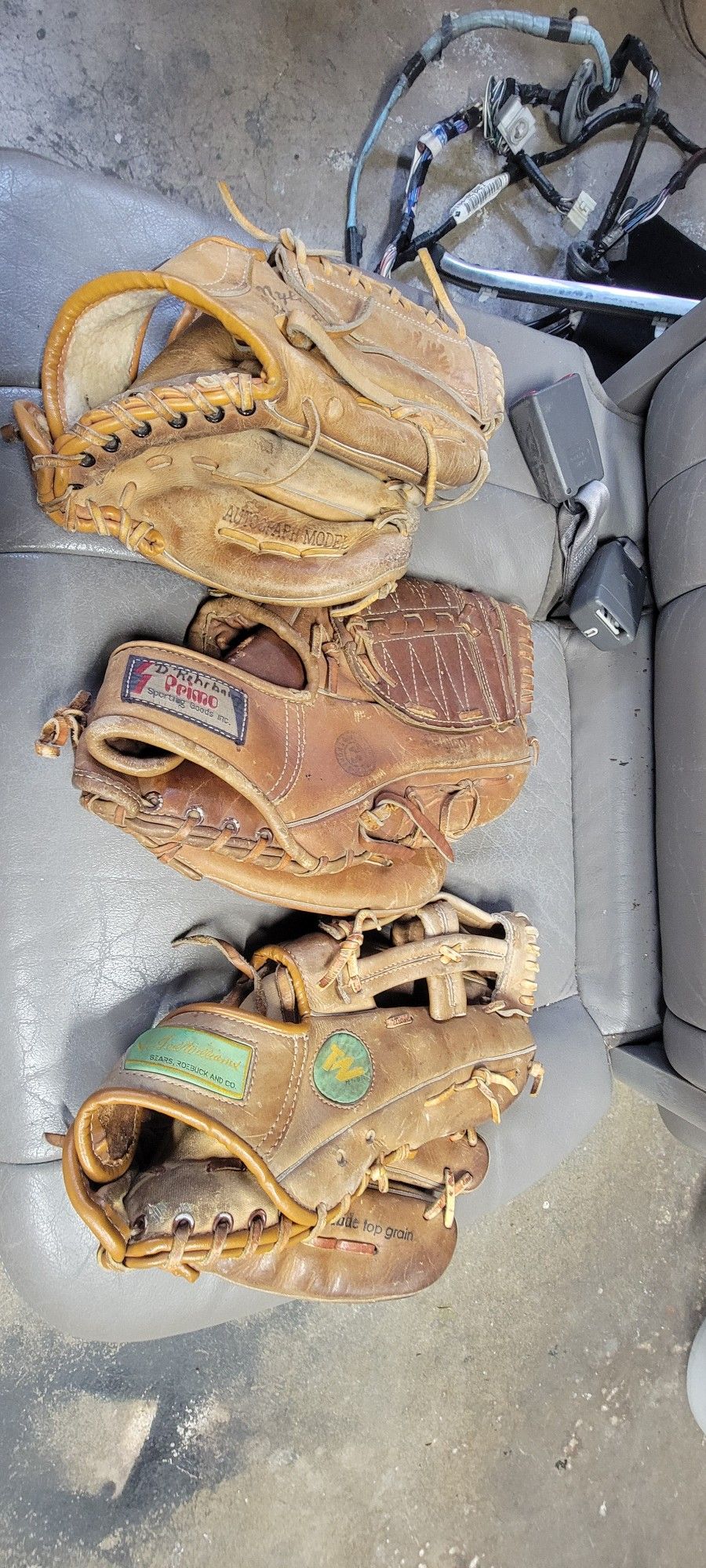 Three Baseball Gloves $25 Each