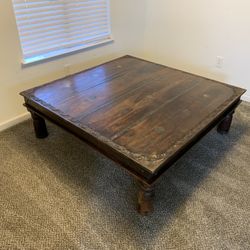Large Rustic 56” x 56” Wood Coffee Table With Edge Carving and Metal Accents