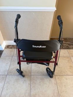 Foldable walker with seat