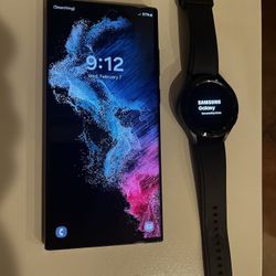 Samsung Galaxy S22 Ultra With Case And Galaxy Watch 4 And Charger 
