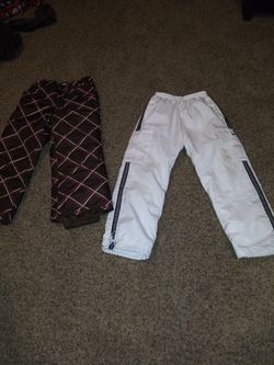 2 pairs of snow pants for sale left 10.00 each buy them now my prizes go up n down