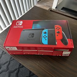 Nintendo Switch Bundle 32GB W/ Super Mario Odyssey, Need for Speed Hot Pursuit and Travel Case