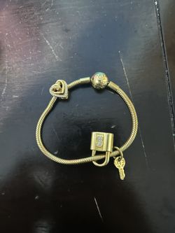 Gold pandora charm bracelet
