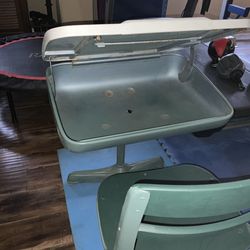 Metal chair and base with a combination metal and wood lift lid revealing book storage space underneath- used- $40