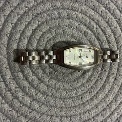 stainless steel Tommy Hilfiger women's wristwatch featuring a rectangular case and bracelet.