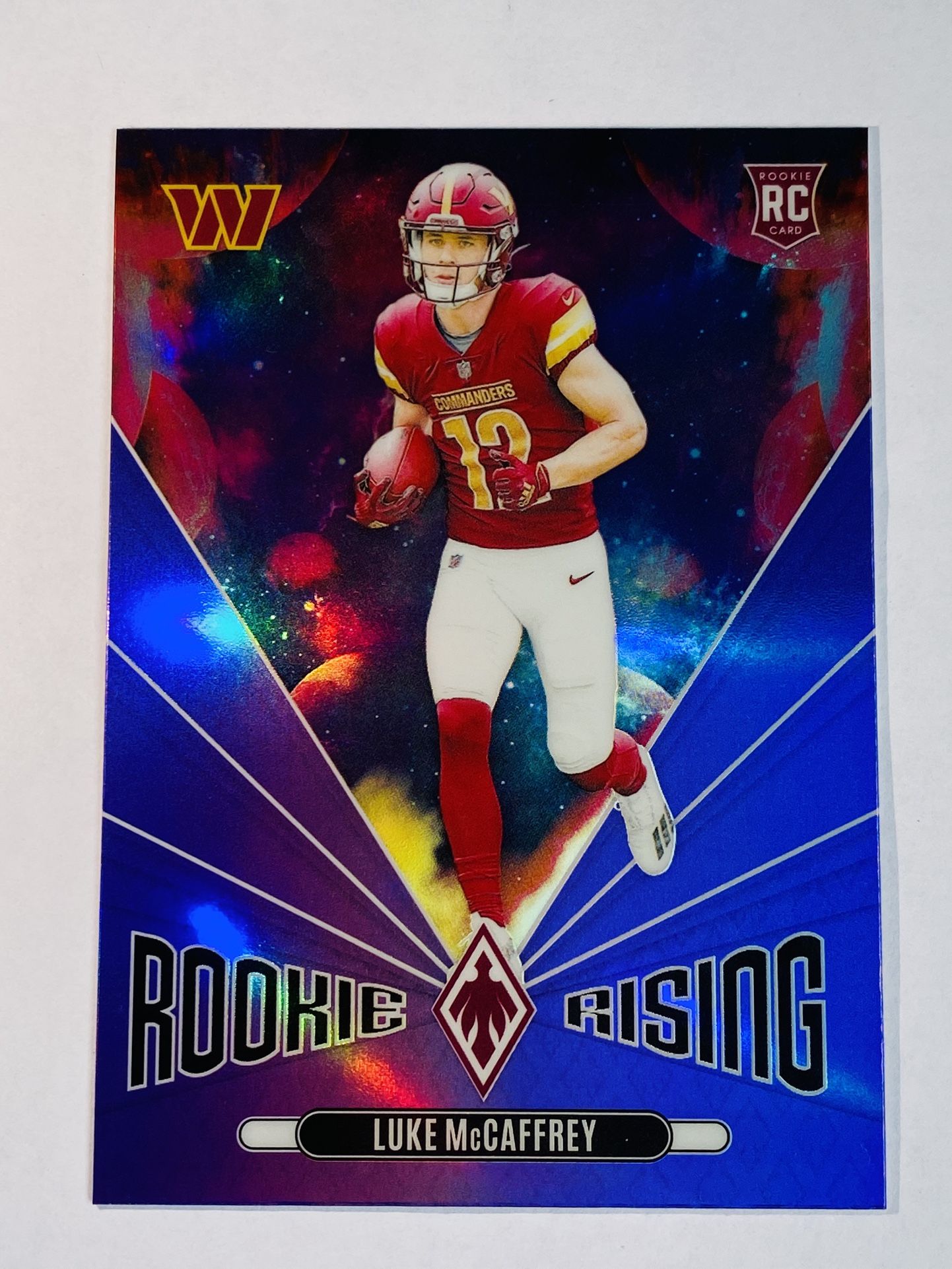 2024 Panini Phoenix Football Luke McCaffrey RC Rookie Rising Purple