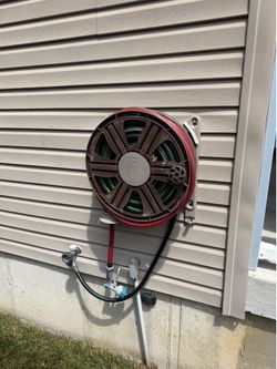 100 foot 5/8” hose and wall mounted reel