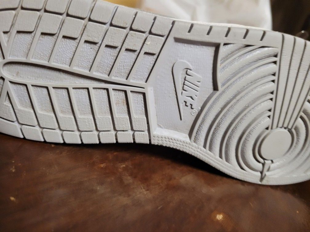 White Nike Air Jordan 1s