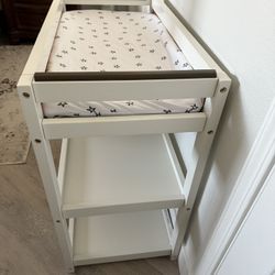 White wood Changing Table with Changing foam Pad and Storage. Clean, pet/smoking free home.